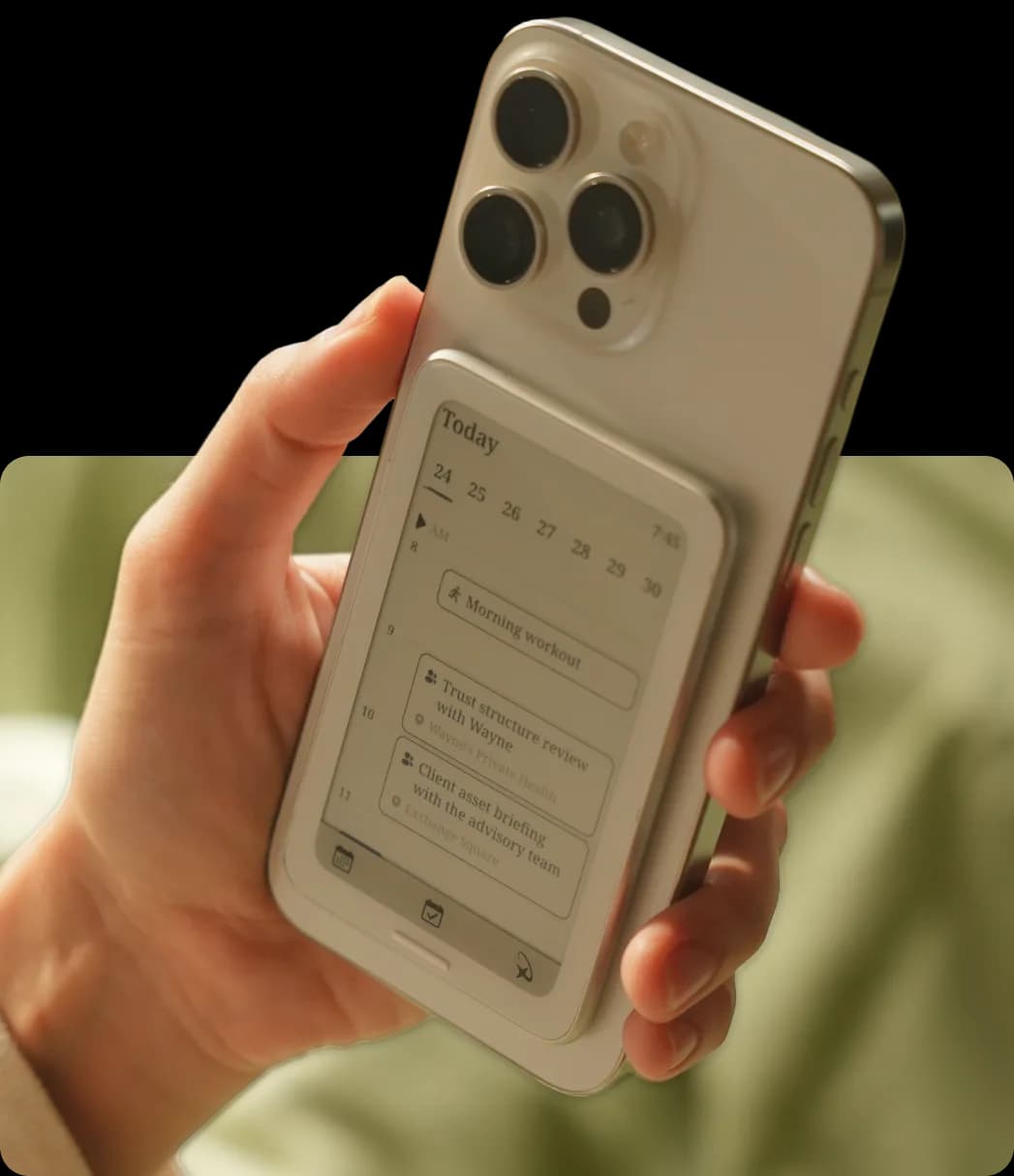 Moonphase flip showing today's schedule on the back of an iPhone
